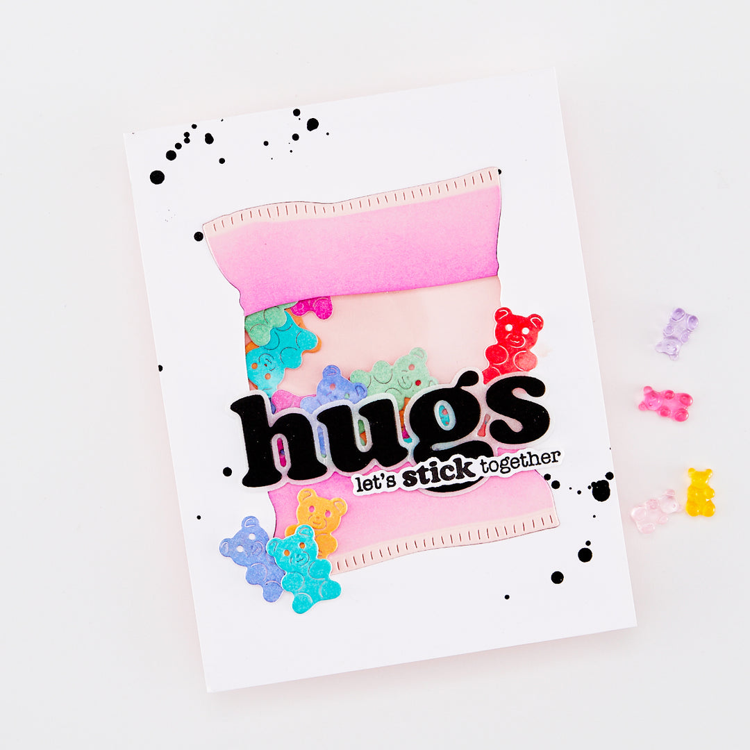 Colorful card with 'hugs let's stick together' text and decorative elements on a white background