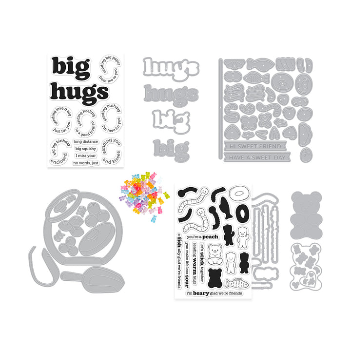 Collection of clear stamps with phrases and metal dies, and gummy bear embellishments.
