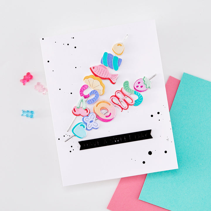 Colorful card with mermaid-themed decorations on a white background