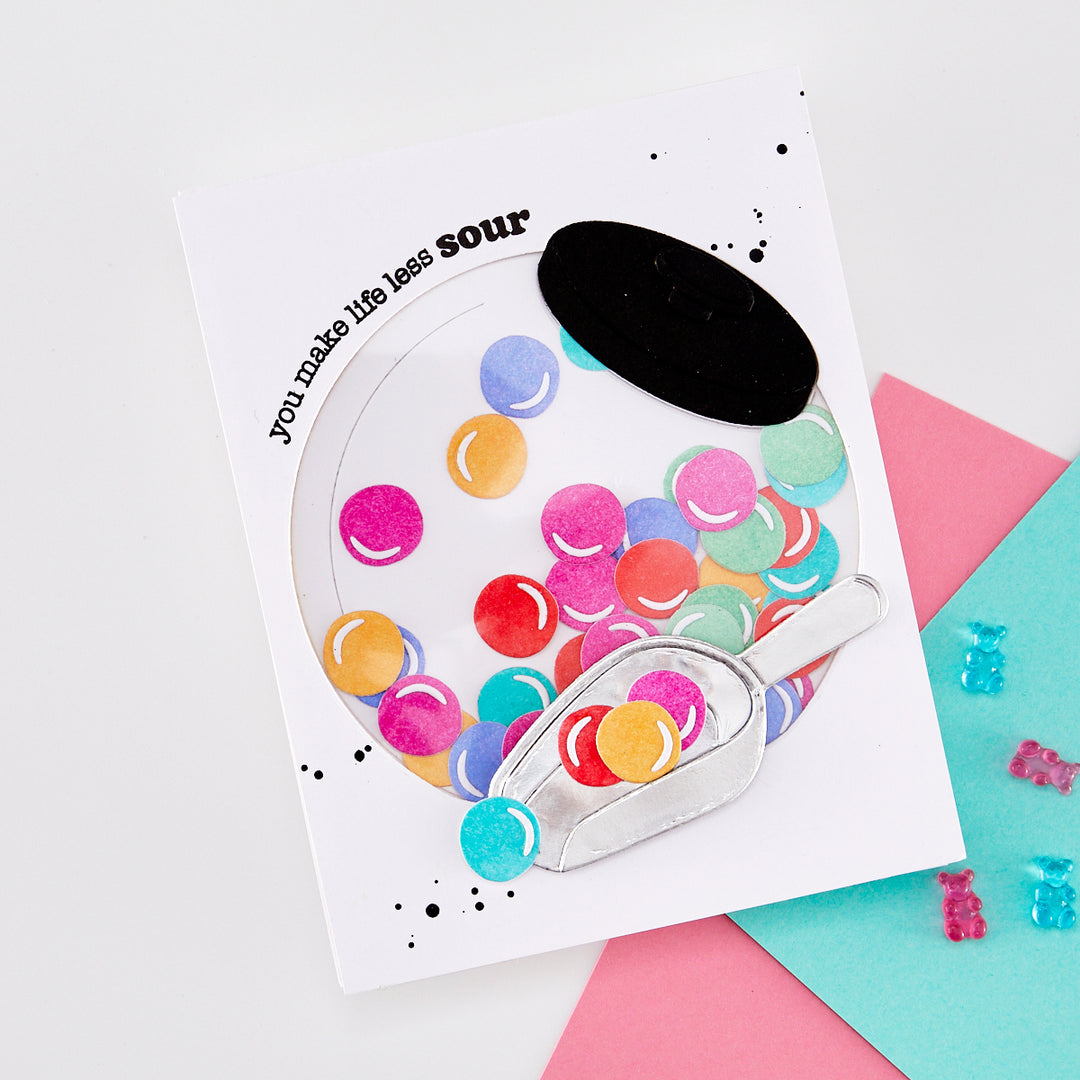 Greeting card with colorful bubblegum balls in a penny jar, on a white background.