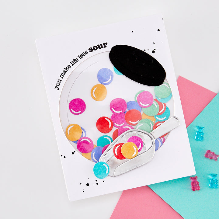 Greeting card with colorful bubblegum balls in a penny jar, on a white background.