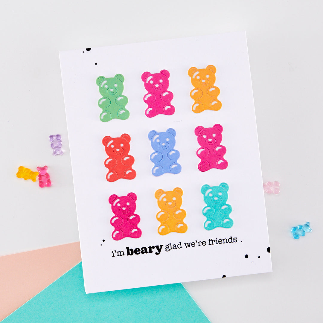 Colorful gummy bear stickers on a white card with text, on a light gray background.